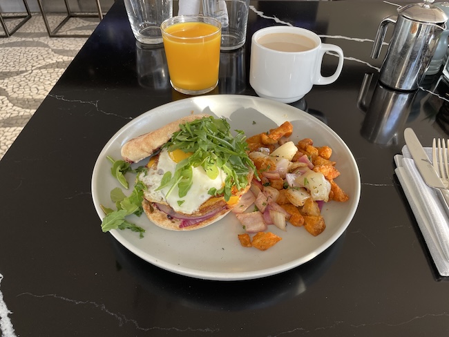 a plate of food and a drink on a table