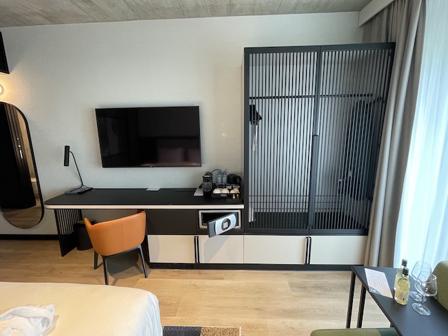 a room with a tv and a screen