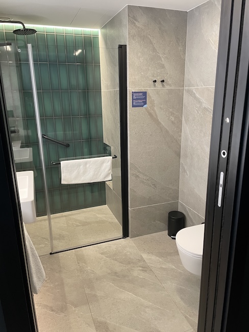 a bathroom with a glass shower door