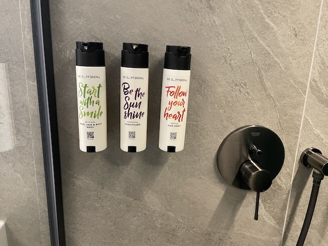 a group of spray bottles on a wall
