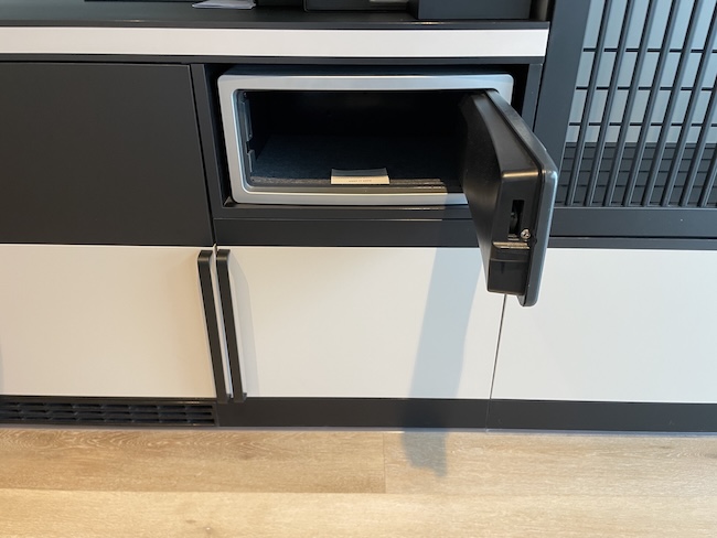 a black and white cabinet with a door open