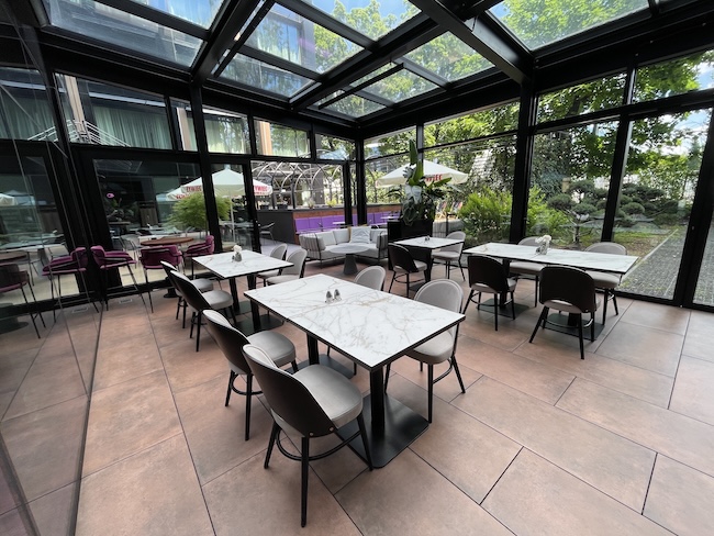 a room with tables and chairs