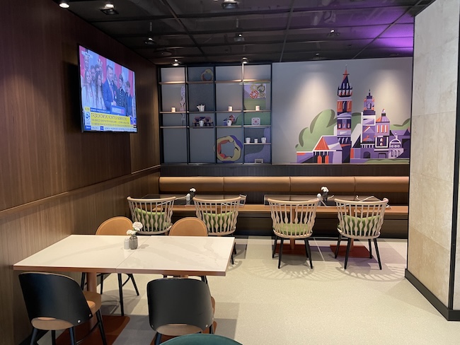 a room with a television and tables