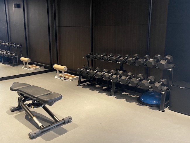 a room with weights and a bench