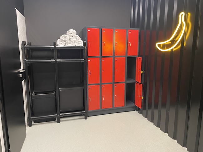 a lockers and a towel on a shelf