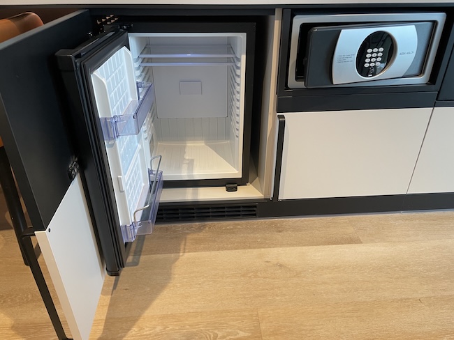 a small black and white refrigerator