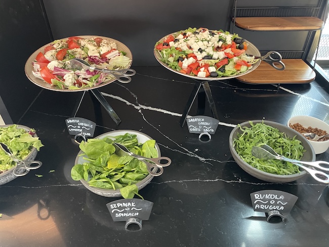 a group of bowls of salad