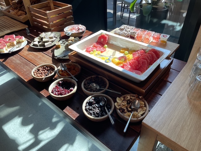 a tray of fruit and nuts on a table