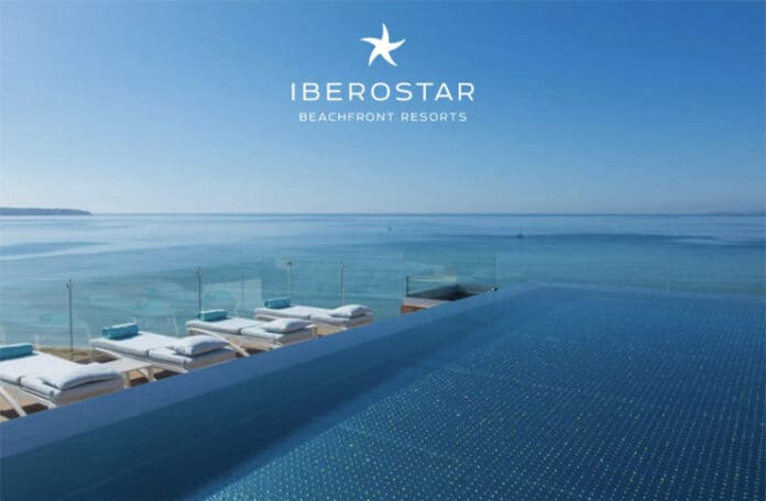 a pool with lounge chairs and a large body of water