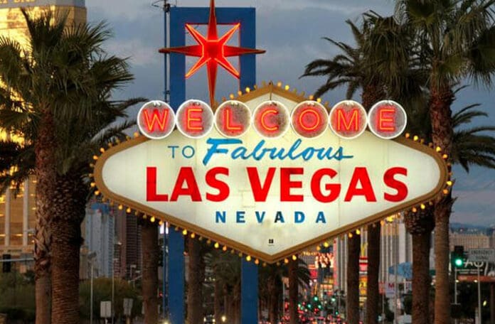 a sign with a star on it with Welcome to Fabulous Las Vegas sign in the background