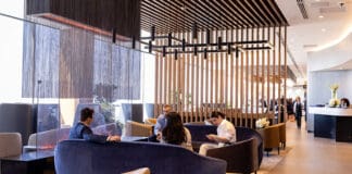 a group of people sitting on couches in a lobby