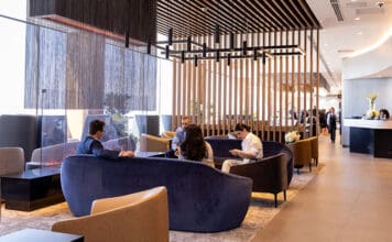 a group of people sitting on couches in a lobby