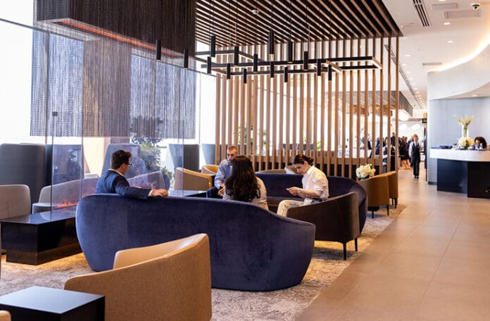 a group of people sitting on couches in a lobby