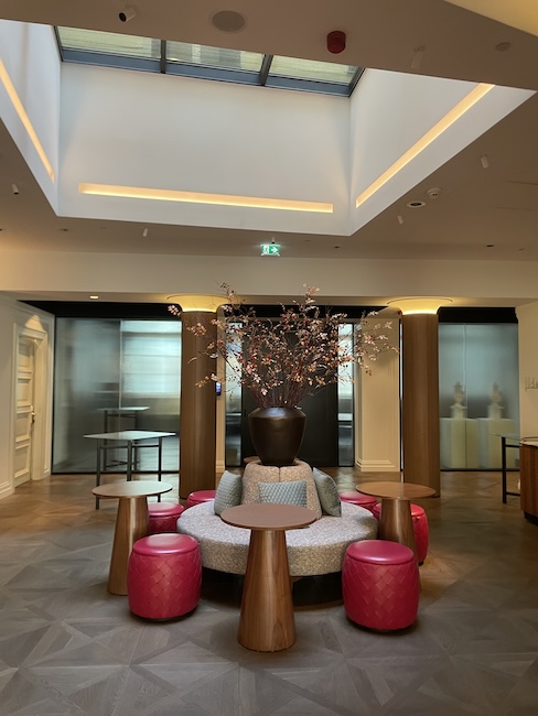a room with a large vase of flowers