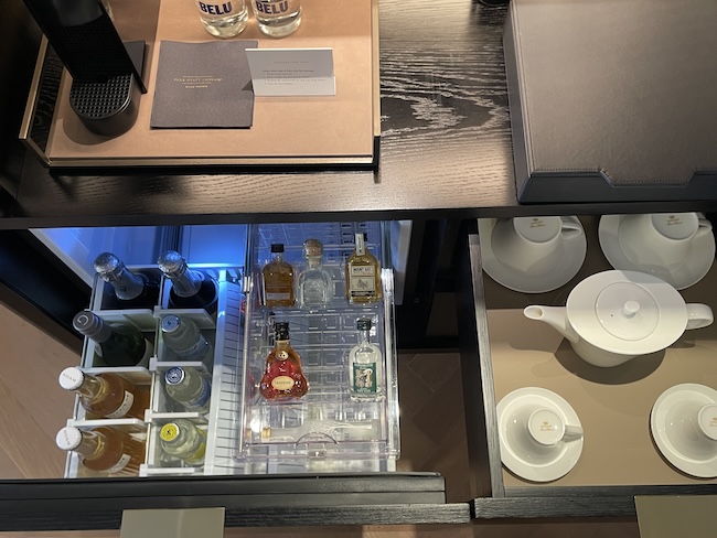 a shelf with bottles in it
