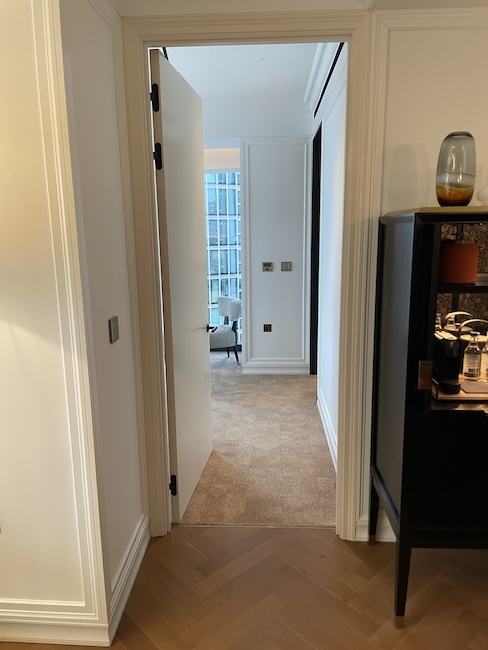 a hallway with a door open