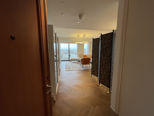a room with a wood floor and a wood floor and a wood door