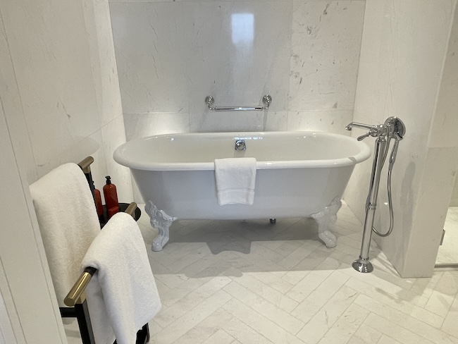 a white bathtub in a bathroom