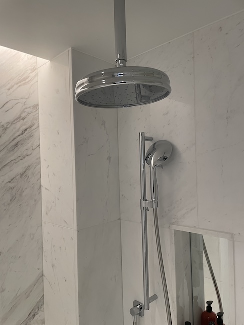 a shower head in a bathroom