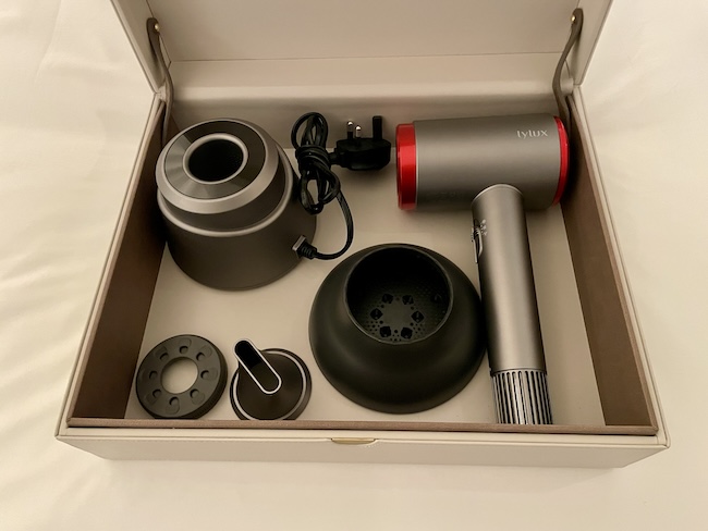 a box with a hair dryer and accessories