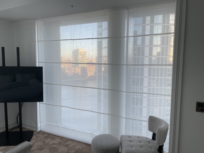 a room with a window and a tv