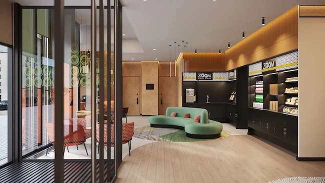 a room with a green couch and a green rug
