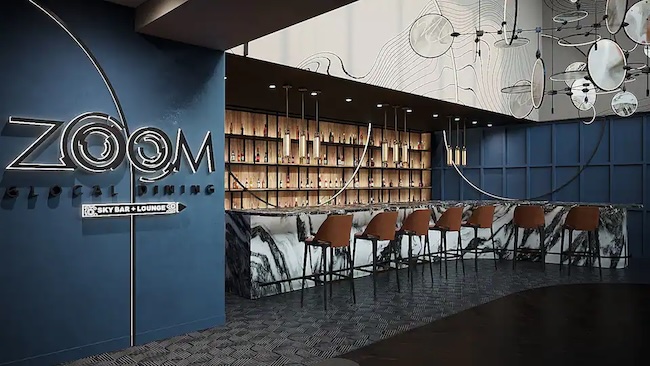 a bar with chairs and a sign