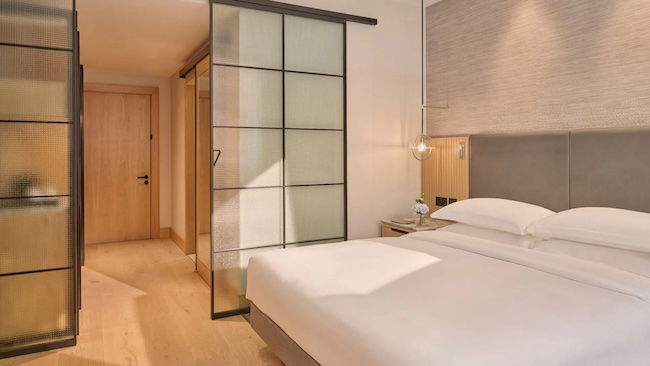 a bedroom with a sliding glass door