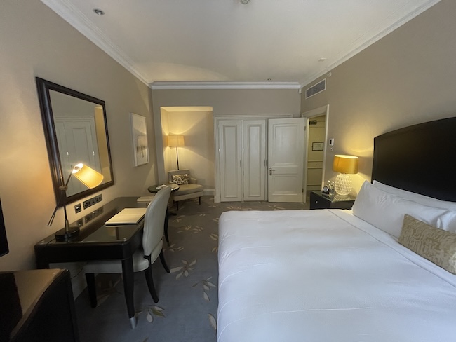 a room with a bed and a desk