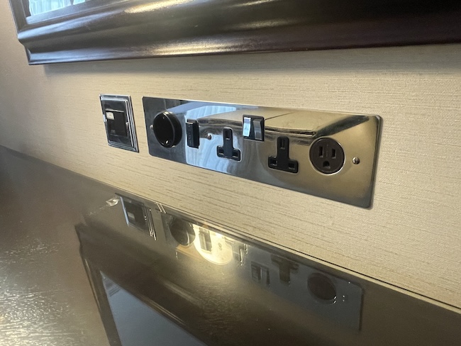 a close up of a wall with switches and switches