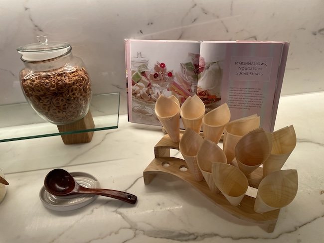 a spoon and bowl of cereal on a table