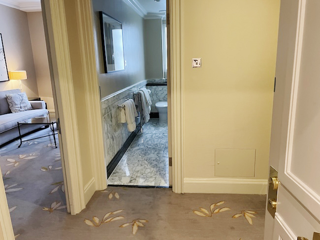 a bathroom with a mirror and a toilet