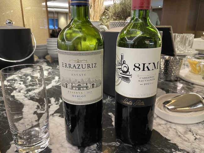 two bottles of wine on a table