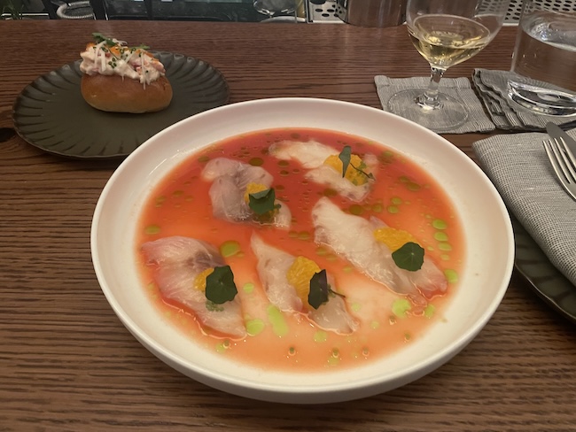 a bowl of soup and a glass of wine