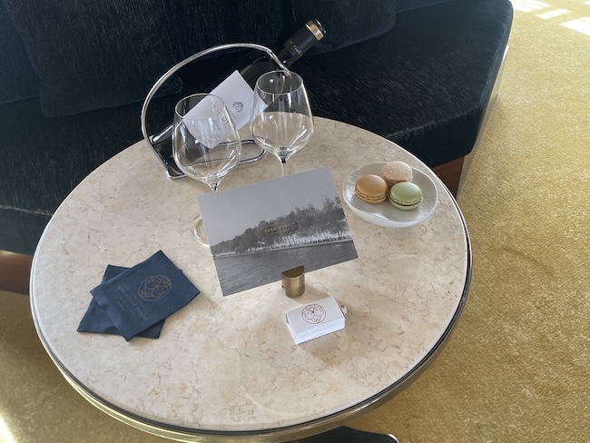 a table with wine glasses and a picture on it