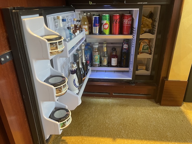 a mini fridge with drinks and beverages