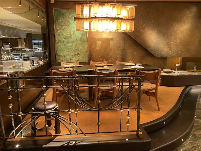 a dining room with a table and chairs