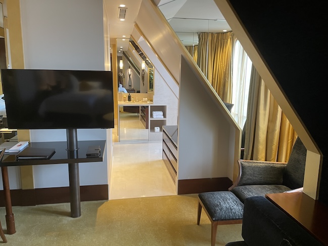 a room with a tv and a table