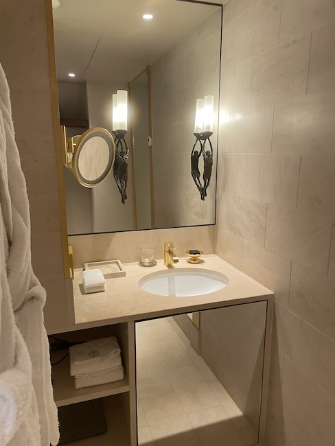a bathroom with a mirror and sink