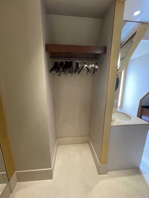a closet with swingers in a hallway