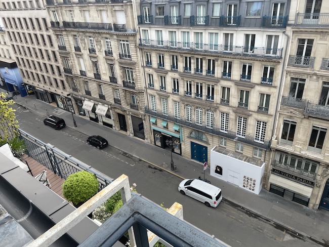 a street with cars and buildings