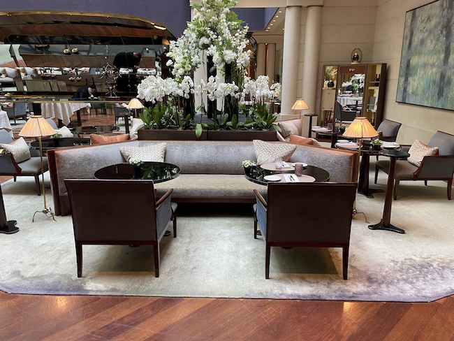 a room with a couch and chairs
