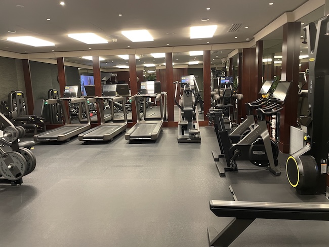 a gym with treadmills and exercise equipment