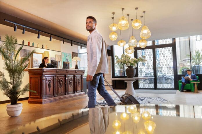 a man walking in a hotel lobby