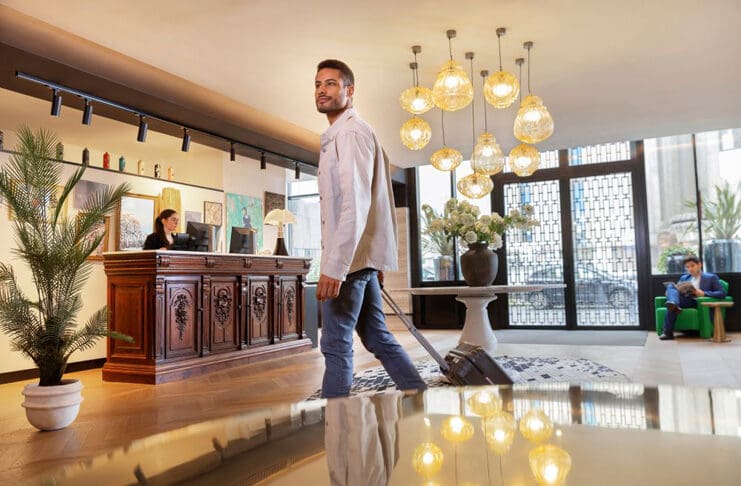 a man walking in a hotel lobby