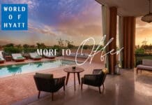 a pool and chairs in a room
