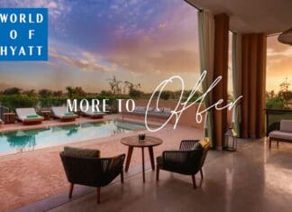 a pool and chairs in a room