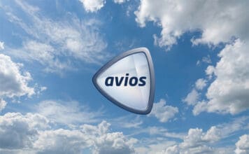 a triangular shaped object with text in the air