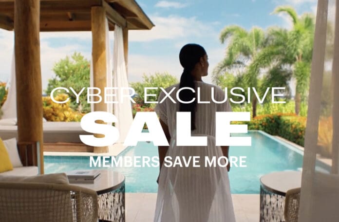 a woman in a white dress by a pool