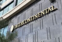 Be careful – Some IHG properties will charge you extra for double occupancy a sign on a building